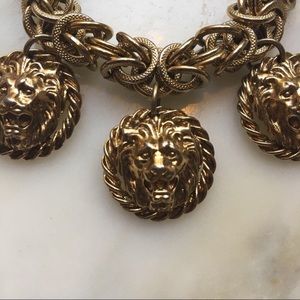 Vintage charm bracelet with lion heads